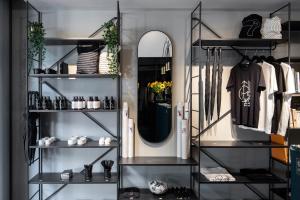 a dressing room with shelves and a mirror at The Modernist Thessaloniki in Thessaloniki