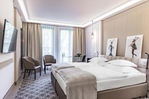 Posteľ alebo postele v izbe v ubytovaní Hotel Traugutta3