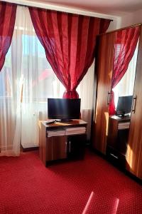 TV a/nebo společenská místnost v ubytování Casa de Vacanta Marjacu