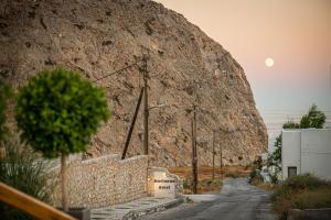 a road leading up to a large rock at Marianna Hotel in Perissa