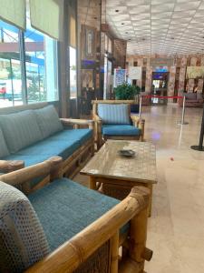 a store with couches and a table in a room at Apartamentos La Jabega in Fuengirola