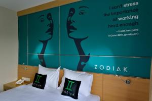 Voodi või voodid majutusasutuse Zodiak MT Haryono by KAGUM Hotels toas