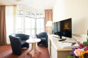 TV a/nebo společenská místnost v ubytování Hotel Traube Rüdesheim