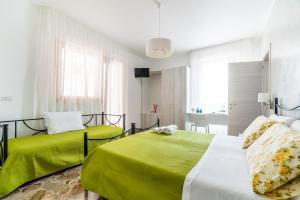 Postel nebo postele na pokoji v ubytování Le Calette Rooms - Puglia Mia Apartments