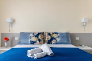 Postel nebo postele na pokoji v ubytování Le Calette Rooms - Puglia Mia Apartments