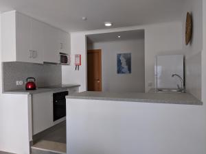 a kitchen with a counter top and a sink at Bayside Salgados in Albufeira