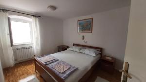 Ένα ή περισσότερα κρεβάτια σε δωμάτιο στο Apartment Uskok