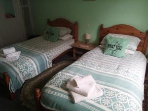 Postel nebo postele na pokoji v ubytování Lenard Charles Bed & Breakfast