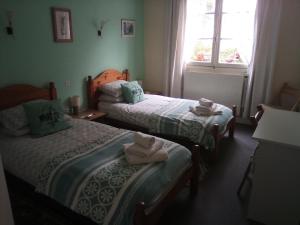 Postel nebo postele na pokoji v ubytování Lenard Charles Bed & Breakfast