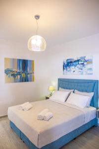 Postel nebo postele na pokoji v ubytování Serenity Luxe Suites