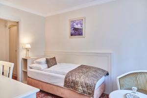 Postel nebo postele na pokoji v ubytování Spa Hotel Centrum