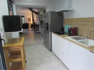 a kitchen with a sink and a counter top at La linotiere in Osly-Courtil