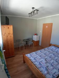 Postel nebo postele na pokoji v ubytování Pokoje Gościnne Zacisze