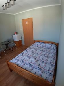 Postel nebo postele na pokoji v ubytování Pokoje Gościnne Zacisze