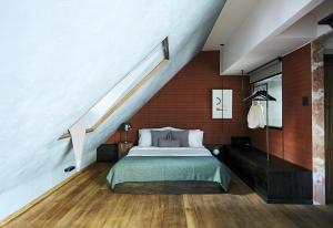 Un ou plusieurs lits dans un hébergement de l'établissement B House 49 Bangkok