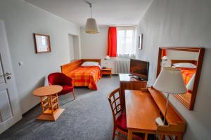 Łóżko lub łóżka w pokoju w obiekcie LH Hotel Dvořák Tábor Congress & Wellness