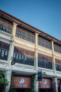 a large building with a lot of windows at Campbell House in George Town
