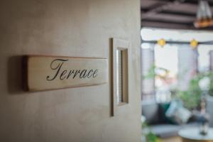 a sign on a wall that reads temmage at Campbell House in George Town