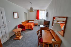 Łóżko lub łóżka w pokoju w obiekcie LH Hotel Dvořák Tábor Congress & Wellness