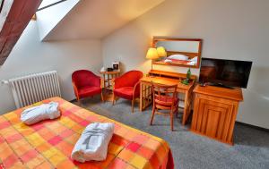 Łóżko lub łóżka w pokoju w obiekcie LH Hotel Dvořák Tábor Congress & Wellness