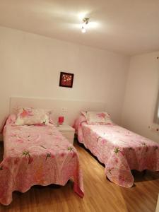 Postel nebo postele na pokoji v ubytování Auga doce