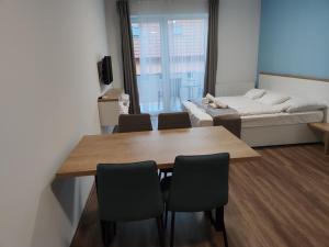 Posteľ alebo postele v izbe v ubytovaní Androméda Apartman