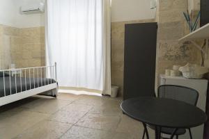 Postel nebo postele na pokoji v ubytování Donato Rooms