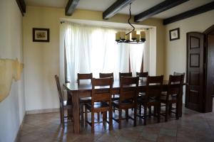 a dining room with a wooden table and chairs at Quo Vadis Lounge Bed & Breakfast in Kazimierz Dolny