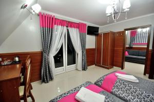 Uma cama ou camas num quarto em Api IV Zakopane