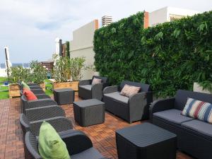 a row of chairs and tables on a patio at Rallye Hotel in L'Escala