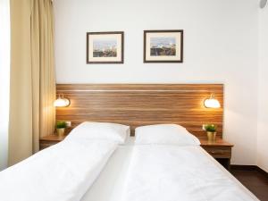 Łóżko lub łóżka w pokoju w obiekcie VacationClub - Arka Apartament 511
