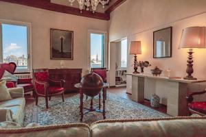 a living room with a couch and a table at Apartment Dorotea Venice view in Venice