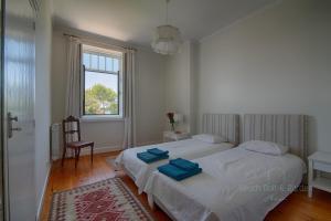 Llit o llits en una habitació de Beach Golf & Garden House