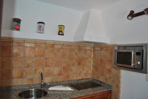 Kuchyň nebo kuchyňský kout v ubytování RK La Casona de Tejeda