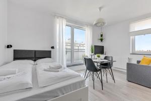 Posteľ alebo postele v izbe v ubytovaní Apartamenty Świętej Barbary