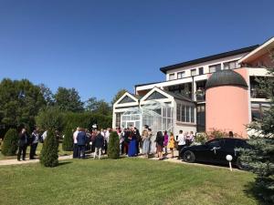 a group of people standing in front of a building at Hotel Shterev Anevo in Sopot
