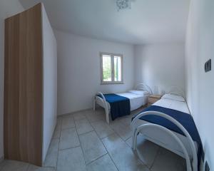 Postel nebo postele na pokoji v ubytování Hotel Residence Miramare