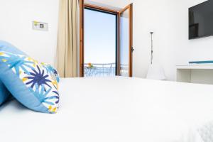 Postel nebo postele na pokoji v ubytování Sapphire Rooms