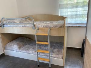 a bunk bed room with two bunk beds and a ladder at Apartma Lavanda in Koper +48 photos
