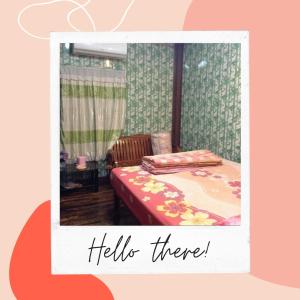 Una foto de un dormitorio con cama y hola en I love you 777 ไอเลิฟยู หัวสนามบิน Pet Friendly Airport Resort, en Ubon Ratchathani