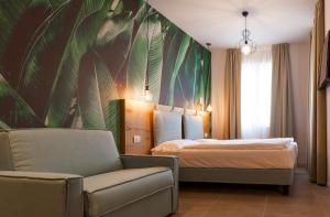 Postel nebo postele na pokoji v ubytování epOche Hotel Zanella 1889 + 37 fotografií