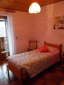Postel nebo postele na pokoji v ubytování Hotel Residence La Rosa