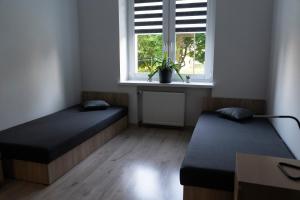 Rúm í herbergi á Apartament Oliwska Przystań