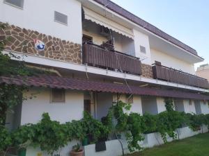 a building with plants on the side of it at Hotel Paralia in Nea Karvali