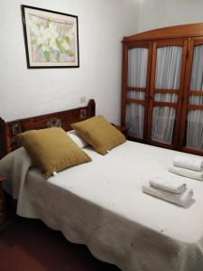 En eller flere senge i et værelse på Cortijo La Solana
