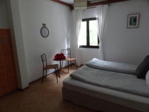 Ein Bett oder Betten in einem Zimmer der Unterkunft Locanda Zott