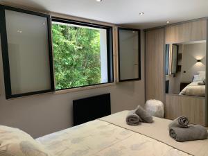 En eller flere senge i et værelse på Aux Pierres Du Clos - Les 3 Vallées