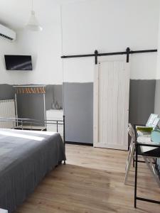 Posteľ alebo postele v izbe v ubytovaní B&B Casa Dalma