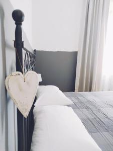 Posteľ alebo postele v izbe v ubytovaní B&B Casa Dalma