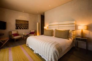 
A bed or beds in a room at The Vines Resort & Spa
